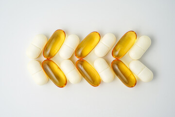 Clock made of pills capsules, pills form a circle, omega, vitamins, Cod liver oil, supplements