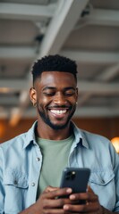 Smiling Young Man Enjoying Mobile Phone Content