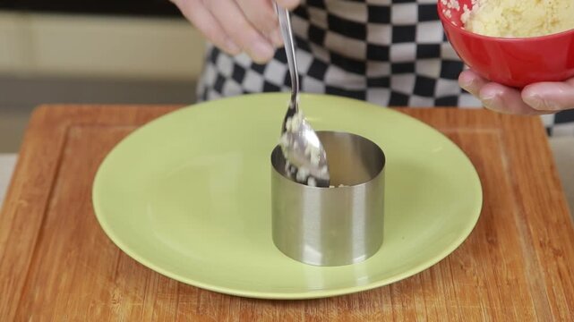 Serving cuscus with grilled vegetables garnish on a plate
