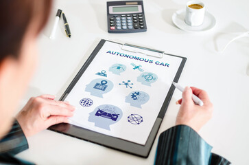Autonomous car concept on a clipboard