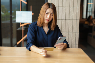 Stressed asian woman facing credit card debt crisis.