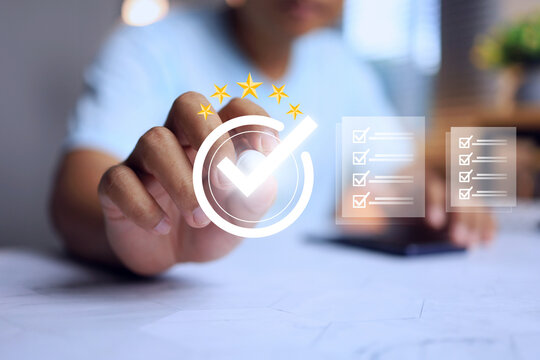 a man's tick chekmark on five star certification that means has been certified to a quality standard or has passed an audit according to industry standards approval