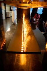 A stunning contemporary fire feature with a vapor display is designed to enhance a modern interior...