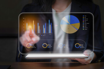 Businesswoman use financial analytics and investment strategies leveraging digital technology to...