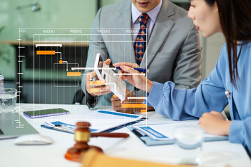 Professional business team in a meeting, planning project timelines with Gantt chart, showcasing...