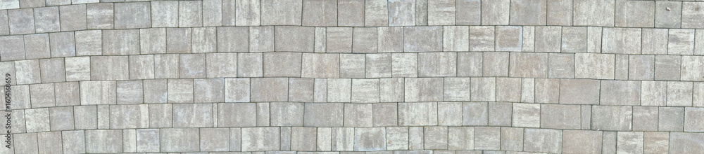 Poster aerial view of a textured cobblestone pavement, featuring a unique pattern in shades of grey, suitab