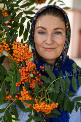 Beautiful woman in a traditional headscarf, summer outdoor