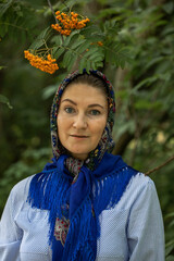 Beautiful woman in a traditional headscarf, summer outdoor
