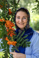 Beautiful woman in a traditional headscarf, summer outdoor