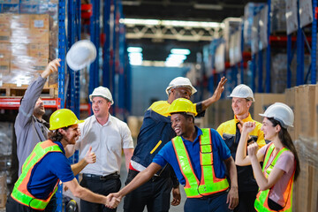 Group photo of warehouse professionals from different ethnicities. Relevant to themes of employee...