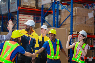 Unified warehouse staff sharing moment of achievement. Perfect for teamwork, diversity, and leadership training visuals.