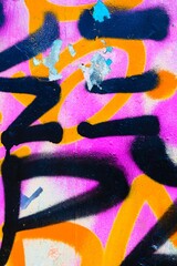 Graffiti art in bold black, orange, pink with peeling layers. Urban 2000s, Y2K style, vibrant display, street art. Posters, social media, creative banner, modern visuals.