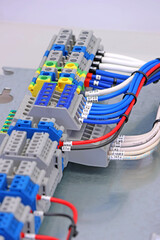 Electrical terminals with connected insulated copper wires with metal lugs. Marking with a thermal...