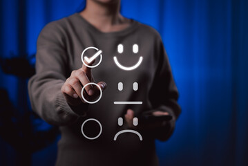 Customer review satisfaction feedback survey concept. A person interacts with virtual icons representing customer satisfaction levels, including happy, neutral, sad faces, and feedback. rating,