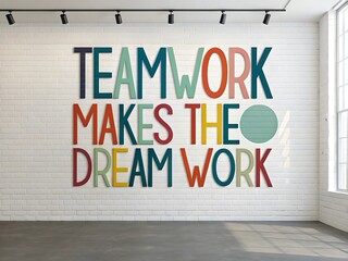 Inspirational teamwork makes the dream work quote painted on a white brick wall