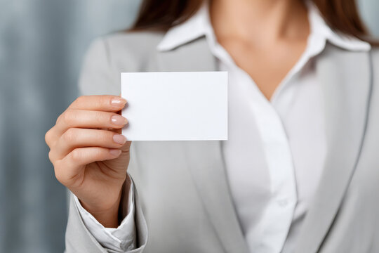 Hands of businesswoman holding white card for text message business branding