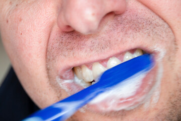 General stock - male using a toothbrush.