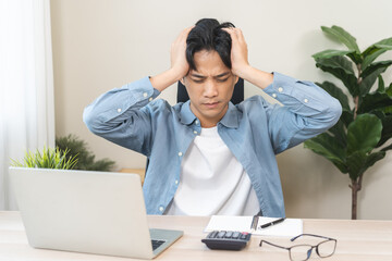 Stressed, exhausted asian young man pain from vertigo, male having migraine symptoms headache, feel...