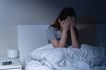 Sad worried and stressed, depressed asian young woman, girl suffering in bed from insomnia problem,...