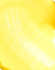 Vivid yellow pigment stroke with artistic texture and shine