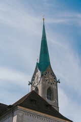 Fototapeta premium Fraumunster church tower reaching for the sky in zurich, switzerland