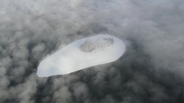 Aerial winter view of Batak Reservoir covered with clouds, Pazardzhik Region, Bulgaria