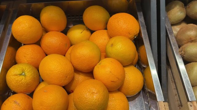 Lemons, Oranges And Tangerines In The Supermarket Displayed In The Citrus Fruit Section Slow Motion Shot