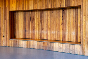 Minimalist timber wall with a built-in bench alcove, showcasing modern architectural design with...