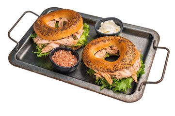 Fresh cooked Bagel sandwich with smoked salmon, lettuce and cream cheese in steel tray isolated on...