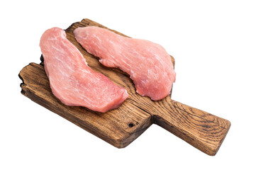 Raw pork fillet steaks,  loin chops on a wooden board isolated on white background. top view