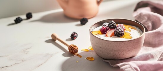 Rustic clay cup filled with creamy kefir and garnished with honey and fresh berries in soft light