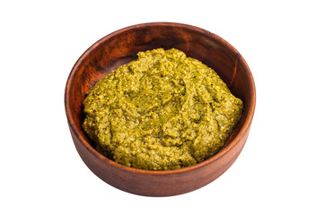 Basil Pesto sauce, Iitalian sauce in a wooden bowl isolated on white background