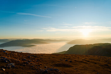 A Mystical Mountain Glows in the Golden Light of a Breathtaking Sunset.