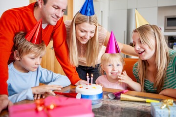 Family Life, Birthday Party. A young family celebrating the youngest daughter's third birthday....