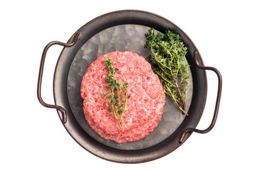 Stack of Raw meat patties, cutlets, chopped meat for burgers in stell tray with herbs isolated on white background