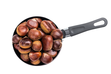 Raw chestnuts in rustic skillet ready for cooking isolated on white background
