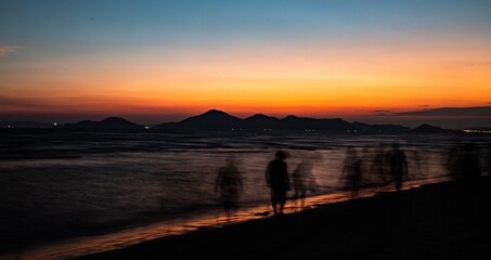  A collection of serene and atmospheric seascape photos from a Korean beach at dusk.

