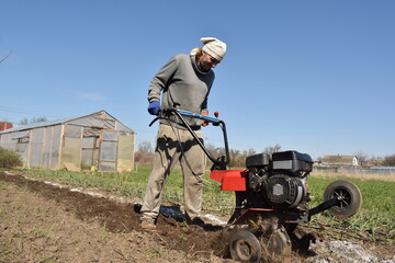 Young man engaged in household chores and small-scale rural farming, tending to his garden with care and dedication. His daily routine reflects a sustainable and self-sufficient way of life