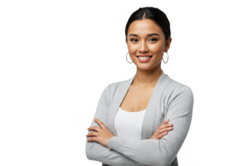 A young asian woman with her arms crossed is smiling in a studio setting isolated on