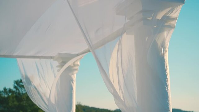 A beautiful white canopy with white flowers on the wedding day. High quality FullHD footage