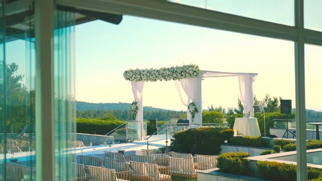 A beautiful white canopy with white flowers on the wedding day. High quality FullHD footage