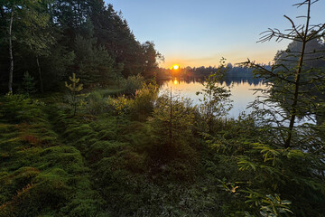 Sunset Over Calm Water Surface