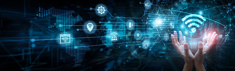 IoT engineer holding global network and Internet of Things systems, smart devices sensors connectivity automation real-time data monitoring integration control analytics infrastructure.