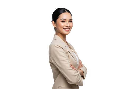 A confident young asian businesswoman in a suit is smiling and looking over her