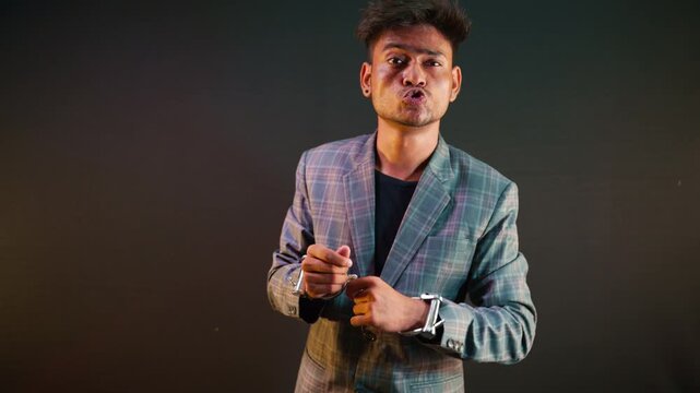 Teasing person imitates silly behavior when escaping cuff