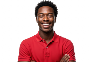 A smiling young african american man with his arms crossed is posing against a