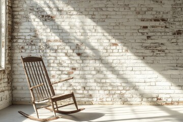 A rustic wooden rocking chair sits against a whitewashed brick wall, bathed in sunlight.