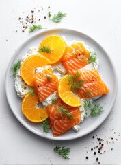 Plate of sliced smoked salmon, cream cheese, and orange slices garnished with fresh dill