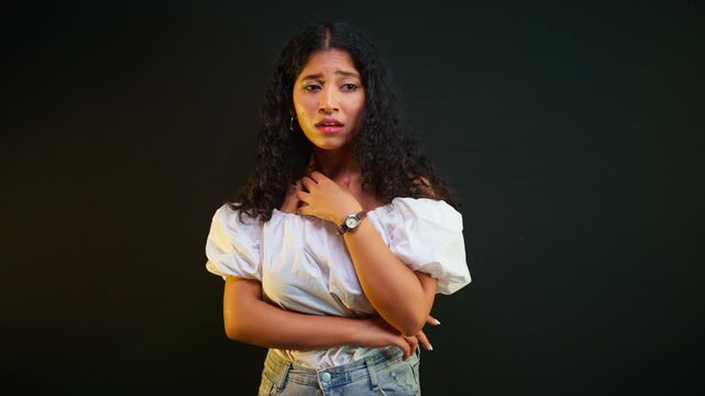 Tearful curly haired girl cries alone in sadness