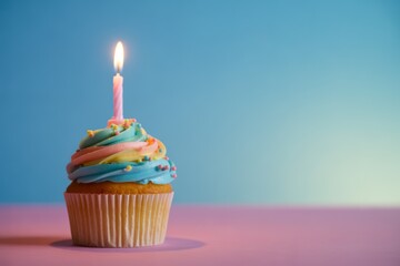 Festive cupcake with lit candle birthday celebration